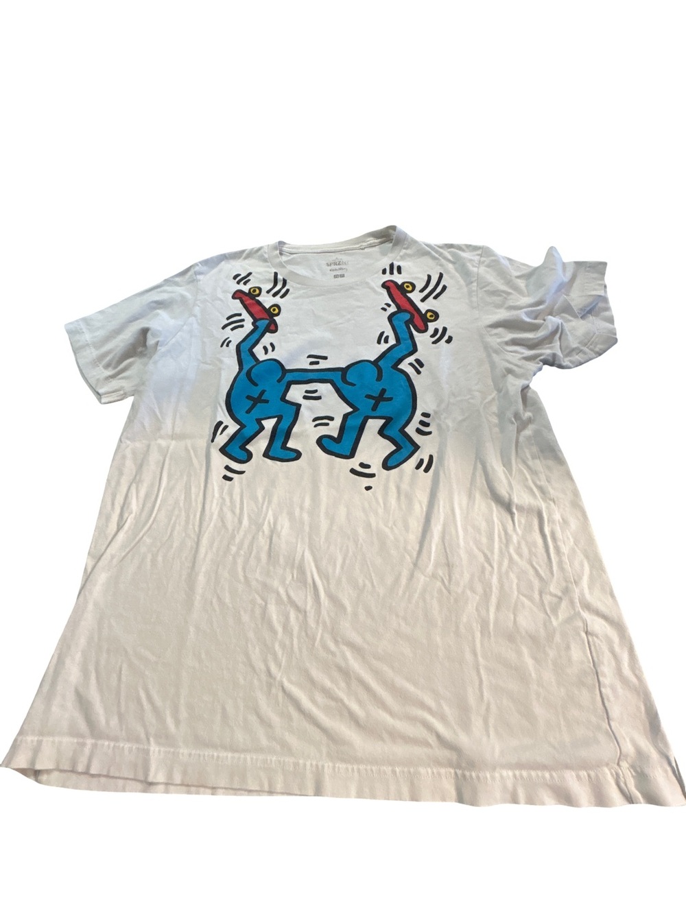 Uniqlo White Short-Sleeve Tee with Blue Graphic and Red Accents